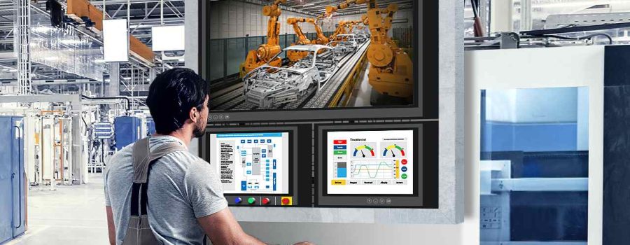 male-worker-using-computer-in-factory